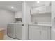 Basement laundry room with washer, dryer, and extra storage at 3636 Evans Rd, Atlanta, GA 30340