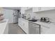 White kitchen with stainless steel appliances and quartz countertops at 3636 Evans Rd, Atlanta, GA 30340