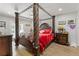 Main bedroom with a large four poster bed and access to backyard at 3636 Evans Rd, Atlanta, GA 30340