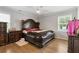 Bright bedroom featuring a king-size bed and hardwood floors at 3636 Evans Rd, Atlanta, GA 30340