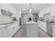Spacious kitchen with white cabinets, large island, and stainless steel appliances at 3636 Evans Rd, Atlanta, GA 30340