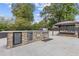 Outdoor kitchen with grill, refrigerator, and stone countertops at 3636 Evans Rd, Atlanta, GA 30340