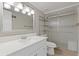 Basement bathroom with a shower, vanity, and built-in shelving at 3636 Evans Rd, Atlanta, GA 30340