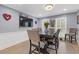 Dining room with dark wood table and chairs, hardwood floors at 3636 Evans Rd, Atlanta, GA 30340