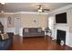 Living room featuring hardwood floors and a fireplace at 3853 Locksley Trl, Douglasville, GA 30135