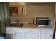 Small outdoor kitchen with microwave and sink at 3853 Locksley Trl, Douglasville, GA 30135