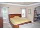 Main bedroom with sitting area and large windows at 3853 Locksley Trl, Douglasville, GA 30135