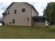 Tan house with a shed and grassy backyard at 3853 Locksley Trl, Douglasville, GA 30135