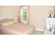 Neutral-toned bedroom with a double bed and window at 3853 Locksley Trl, Douglasville, GA 30135
