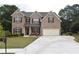 Two story brick home with a two car garage at 3853 Locksley Trl, Douglasville, GA 30135