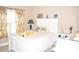Bright bedroom with white furniture and large window at 3853 Locksley Trl, Douglasville, GA 30135