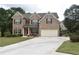 Two story brick home with a two car garage at 3853 Locksley Trl, Douglasville, GA 30135