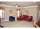 Comfortable bonus room featuring a sectional sofa and large windows at 3853 Locksley Trl, Douglasville, GA 30135