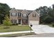 Two story brick home with a two car garage at 3853 Locksley Trl, Douglasville, GA 30135