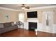 Bright living room with hardwood floors and a fireplace at 3853 Locksley Trl, Douglasville, GA 30135
