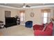 Large bonus room with a sectional sofa and plenty of natural light at 3853 Locksley Trl, Douglasville, GA 30135