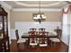 Formal dining room with chandelier and wainscoting at 3853 Locksley Trl, Douglasville, GA 30135
