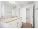 Bright bathroom with white cabinets and granite at 3028 Viewpark Cir, Conyers, GA 30013