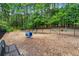 Fenced dog park with agility equipment and benches, providing pet-friendly amenities at 1079 Arbor Ne Trce, Atlanta, GA 30319