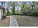Large backyard with a concrete pathway at 15 Johnson Nw Rd, Atlanta, GA 30318