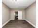 Spacious bedroom with hardwood floors and access to another room at 15 Johnson Nw Rd, Atlanta, GA 30318