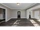 Spacious living area with hardwood floors and access to other rooms at 15 Johnson Nw Rd, Atlanta, GA 30318