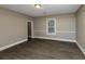 Well-lit bedroom with hardwood floors and access to bathroom at 15 Johnson Nw Rd, Atlanta, GA 30318