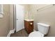 Bathroom with toilet, sink, and wood vanity at 15 Johnson Nw Rd, Atlanta, GA 30318