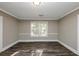 Bright bedroom with hardwood floors and large window at 15 Johnson Nw Rd, Atlanta, GA 30318