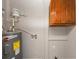 Laundry area with cabinets and water heater at 15 Johnson Nw Rd, Atlanta, GA 30318