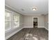 Living room featuring hardwood floors and view into kitchen area at 15 Johnson Nw Rd, Atlanta, GA 30318