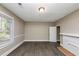 Bedroom with hardwood floors, fireplace and window at 15 Johnson Nw Rd, Atlanta, GA 30318