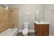 Updated bathroom with tile shower/tub combo, vanity, and toilet at 15 Johnson Nw Rd, Atlanta, GA 30318