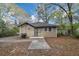 Rear view of tan house with small patio at 15 Johnson Nw Rd, Atlanta, GA 30318