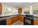 Cozy kitchen with wood cabinets and dark countertops at 15 Johnson Nw Rd, Atlanta, GA 30318