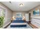 Main bedroom with hardwood floors, fireplace and ocean art at 15 Johnson Nw Rd, Atlanta, GA 30318