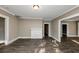 Living room with hardwood floors, fireplace and access to other rooms at 15 Johnson Nw Rd, Atlanta, GA 30318