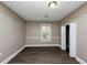 Well-lit bedroom with hardwood floors and a spacious closet at 15 Johnson Nw Rd, Atlanta, GA 30318