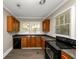 Efficient kitchen with wood cabinets and modern appliances at 15 Johnson Nw Rd, Atlanta, GA 30318