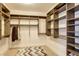 Spacious walk-in closet with custom shelving and hanging rods at 1065 Peachtree Ne St # 3505, Atlanta, GA 30309