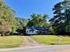 White house with a screened porch and a large yard at 3970 Norman Rd, Stone Mountain, GA 30083