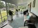 Bright and airy screened porch with comfortable seating and potted plants at 3970 Norman Rd, Stone Mountain, GA 30083