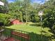 View of a backyard from a deck with a bench at 2681 Buford Hwy, Cumming, GA 30041