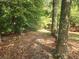 Pathway leading through a wooded area at 2681 Buford Hwy, Cumming, GA 30041
