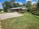 Brick ranch house with carport and mature trees at 2681 Buford Hwy, Cumming, GA 30041