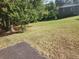Landscaped front yard with a paved driveway at 2681 Buford Hwy, Cumming, GA 30041