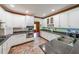 Modern kitchen with white cabinets and granite countertops at 75 Winn Rd, Douglasville, GA 30134