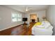 Bright living room with hardwood floors, neutral walls and a comfy sofa at 123 Arnold Pl, Jonesboro, GA 30236
