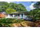 Ranch-style house with gray brick, white siding, and blue door at 123 Arnold Pl, Jonesboro, GA 30236