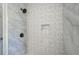 Shower with gray tile and patterned accent wall at 123 Arnold Pl, Jonesboro, GA 30236